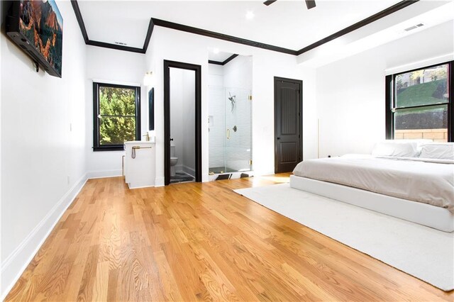 unfurnished bedroom with ornamental molding, light hardwood / wood-style flooring, and ensuite bathroom