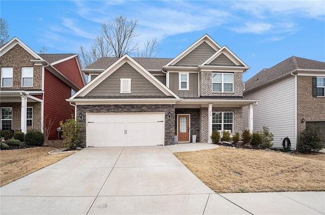 craftsman inspired home featuring board and batten siding, stone siding, driveway, and an attached garage