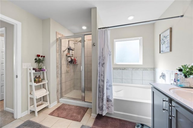 450 Noblewood Dr, Mcdonough, GA 30252 - full bathroom with a stall shower, a garden tub, tile patterned floors, and vanity