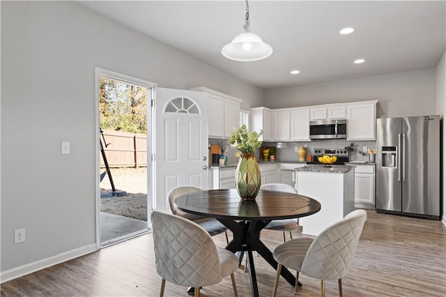 dining area featuring hardwood / wood-style flooring