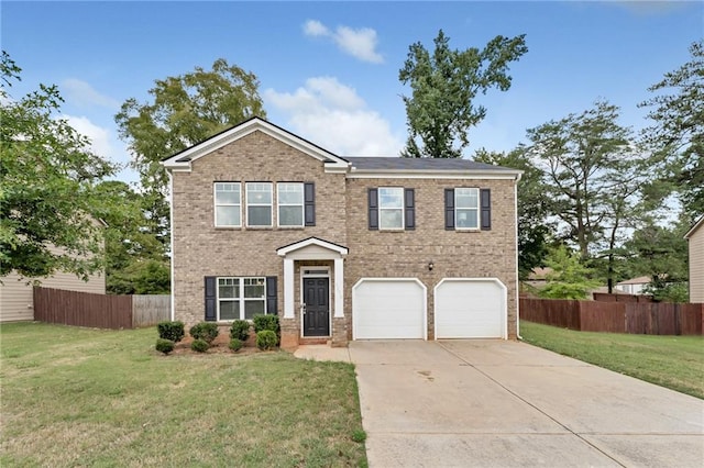 view of front facade with a front yard and a garage