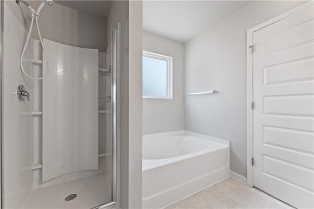 bathroom featuring separate shower and tub