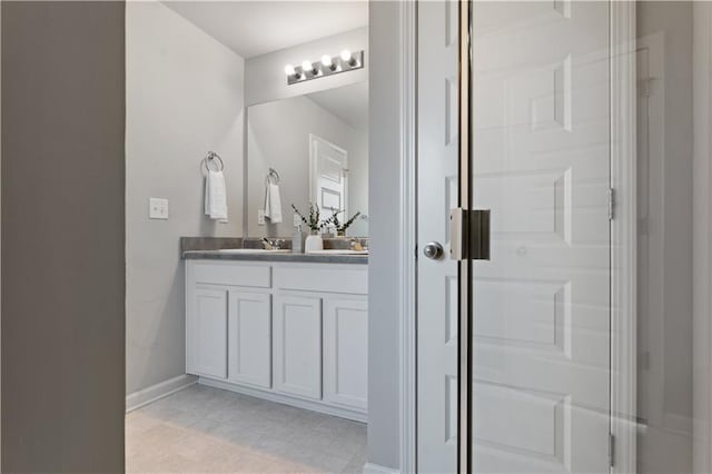 bathroom featuring vanity and a shower with shower door