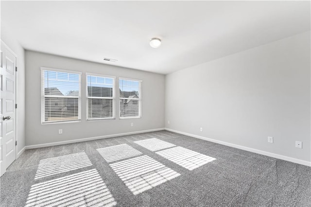 unfurnished room featuring carpet floors