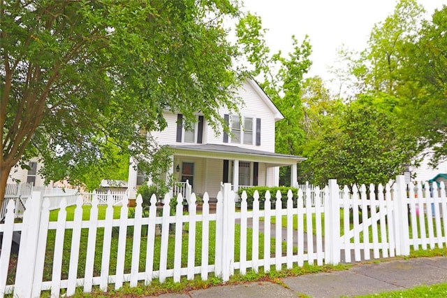 view of front facade featuring covered porch and a front lawn