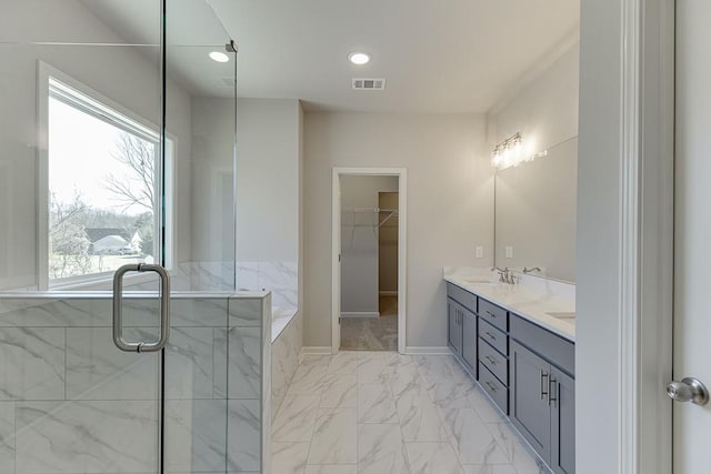 bathroom featuring baseboards, visible vents, double vanity, a sink, and marble finish floor