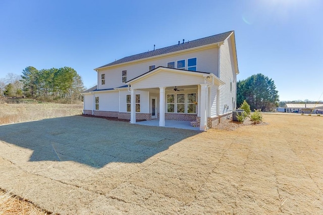 rear view of house featuring a patio and ceiling fan