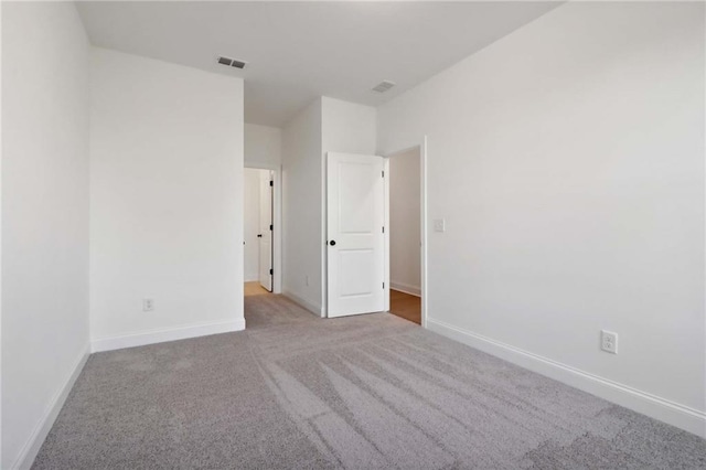 unfurnished bedroom featuring light colored carpet