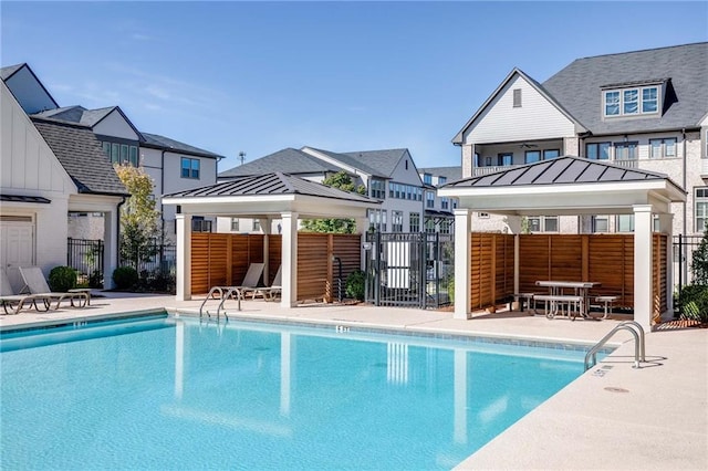 view of swimming pool with a gazebo and a patio area