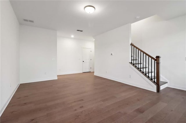 spare room featuring dark hardwood / wood-style floors