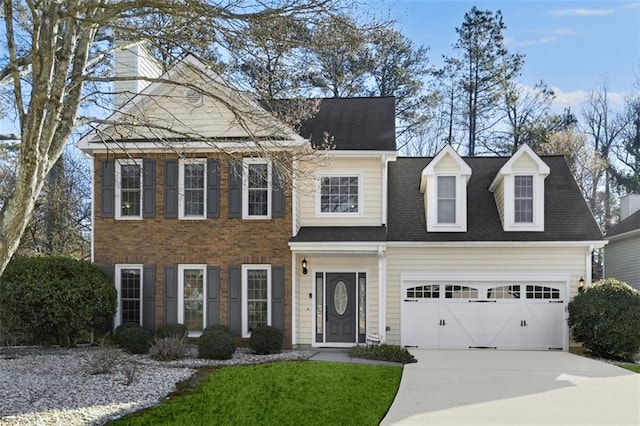 view of front facade featuring an attached garage and concrete driveway