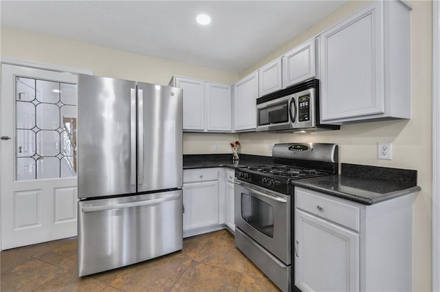 kitchen featuring appliances with stainless steel finishes and white cabinets