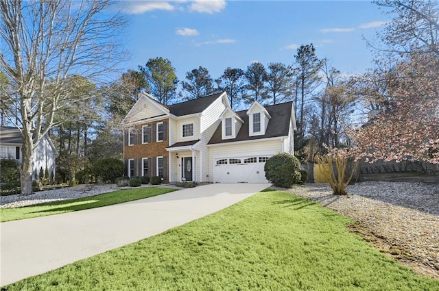 colonial inspired home with a garage, concrete driveway, and a front yard