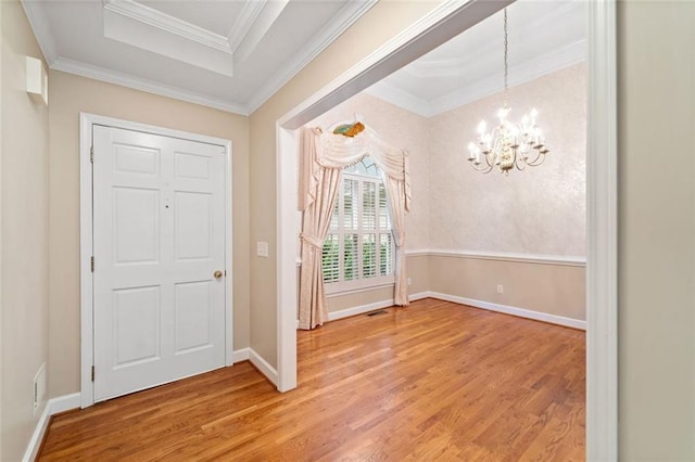 2140 Old Orchard Ln, Canton, GA 30114 - entrance foyer featuring light wood-style floors, a chandelier, crown molding, and a tray ceiling