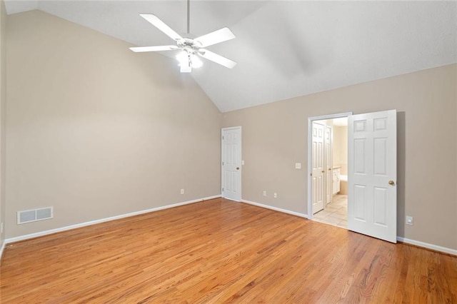 2140 Old Orchard Ln, Canton, GA 30114 - unfurnished bedroom featuring lofted ceiling, light wood-style floors, ensuite bath, and ceiling fan