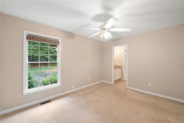 2140 Old Orchard Ln, Canton, GA 30114 - unfurnished bedroom with light colored carpet, ensuite bath, and a ceiling fan