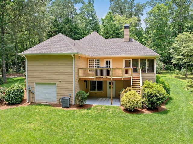 2140 Old Orchard Ln, Canton, GA 30114 - back of house featuring roof with shingles, a chimney, a wooden deck, and a lawn