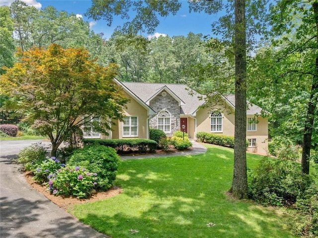 2140 Old Orchard Ln, Canton, GA 30114 - view of front of property featuring stone siding, a front lawn, and stucco siding