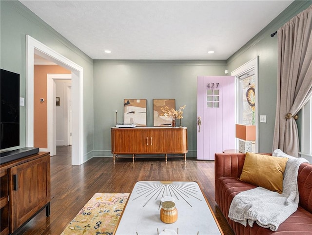 living room featuring ornamental molding, dark wood finished floors, and baseboards