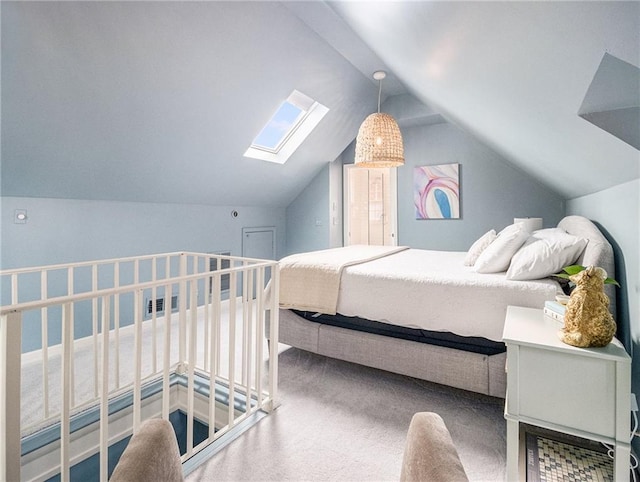 carpeted bedroom with vaulted ceiling with skylight