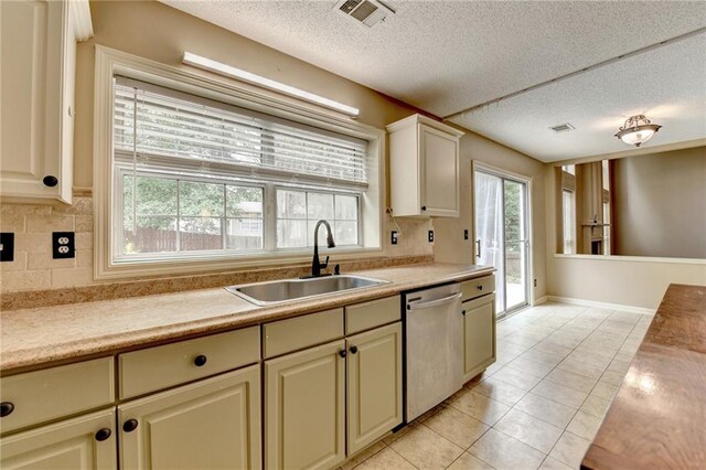12060 Carriage Park Ln, Duluth, GA 30097 - kitchen featuring dishwasher, a sink, light countertops, backsplash, and a textured ceiling