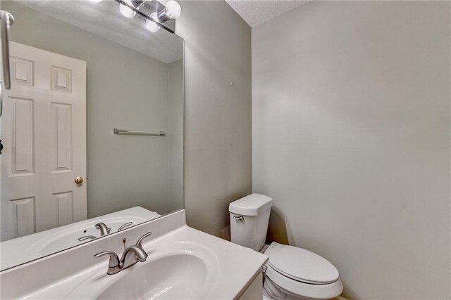 12060 Carriage Park Ln, Duluth, GA 30097 - bathroom with toilet and vanity