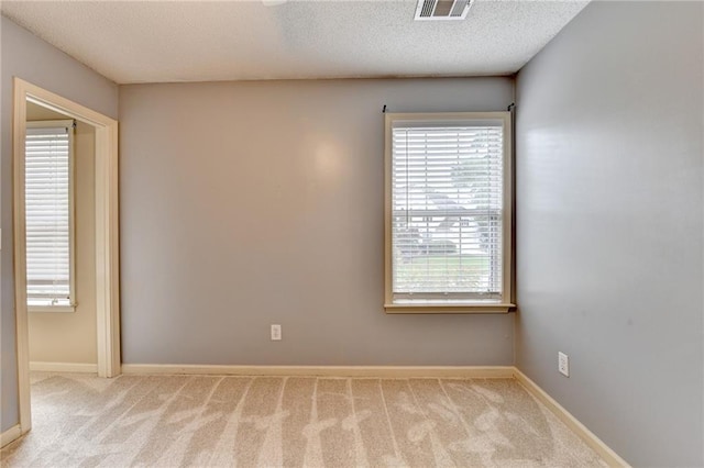 12060 Carriage Park Ln, Duluth, GA 30097 - carpeted spare room with baseboards and a textured ceiling