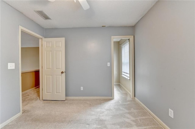 12060 Carriage Park Ln, Duluth, GA 30097 - unfurnished bedroom featuring carpet flooring, baseboards, and ceiling fan