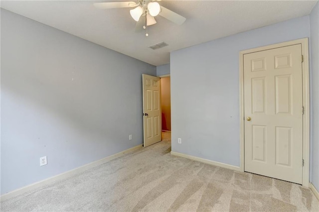 12060 Carriage Park Ln, Duluth, GA 30097 - unfurnished bedroom with carpet floors, baseboards, and a ceiling fan