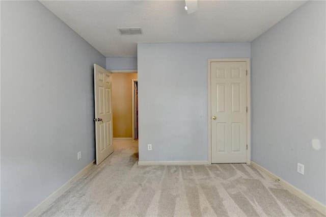 12060 Carriage Park Ln, Duluth, GA 30097 - unfurnished bedroom featuring light colored carpet and baseboards