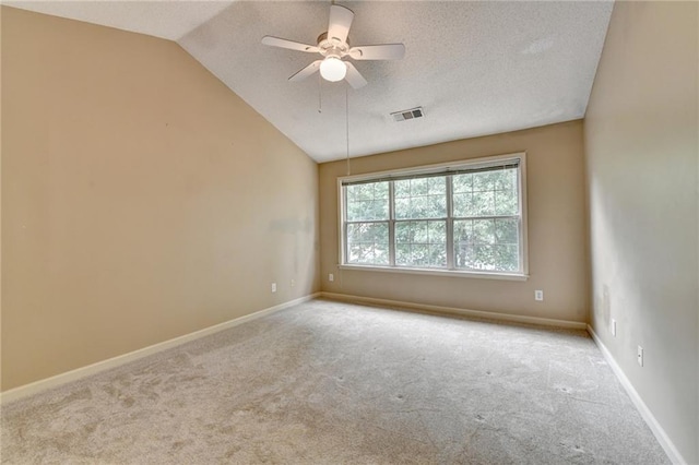 12060 Carriage Park Ln, Duluth, GA 30097 - carpeted empty room with vaulted ceiling, a textured ceiling, a ceiling fan, and baseboards