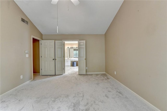 12060 Carriage Park Ln, Duluth, GA 30097 - unfurnished bedroom with lofted ceiling, carpet floors, baseboards, connected bathroom, and ceiling fan