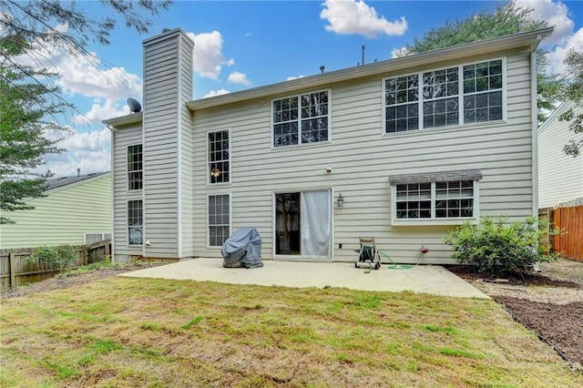 12060 Carriage Park Ln, Duluth, GA 30097 - back of house featuring a patio and a chimney