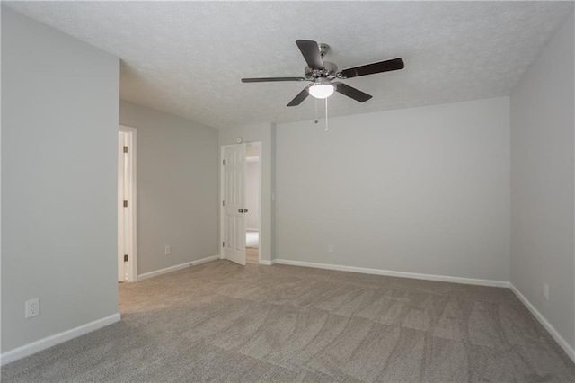 740 Stoneside Ct, Stone Mountain, GA 30083 - carpeted spare room with ceiling fan, a textured ceiling, and baseboards