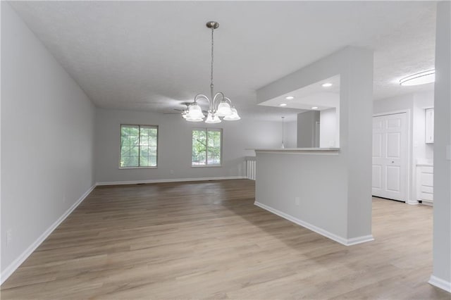 740 Stoneside Ct, Stone Mountain, GA 30083 - unfurnished dining area featuring a chandelier, light wood-style flooring, baseboards, and recessed lighting