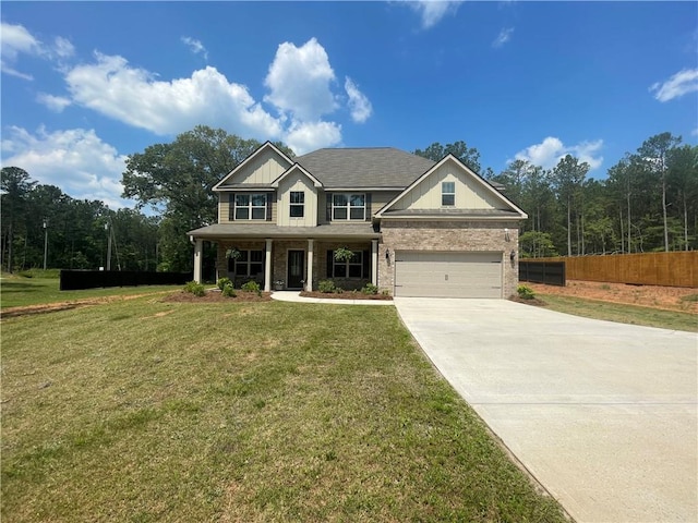 view of front facade featuring covered porch, fence, driveway, and a front lawn