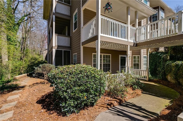 back of house featuring covered porch