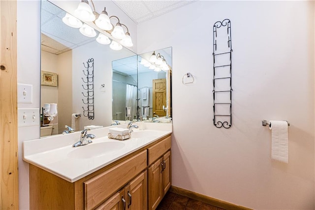 bathroom featuring tile patterned flooring and vanity