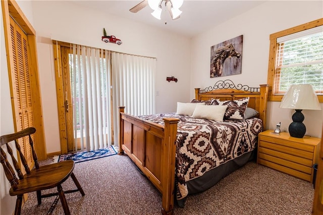 carpeted bedroom with a closet and ceiling fan