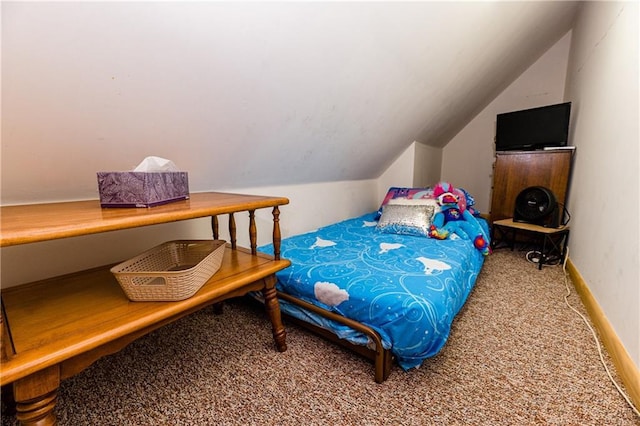 carpeted bedroom featuring vaulted ceiling