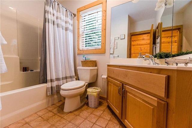 full bathroom with toilet, vanity, and shower / bath combo with shower curtain