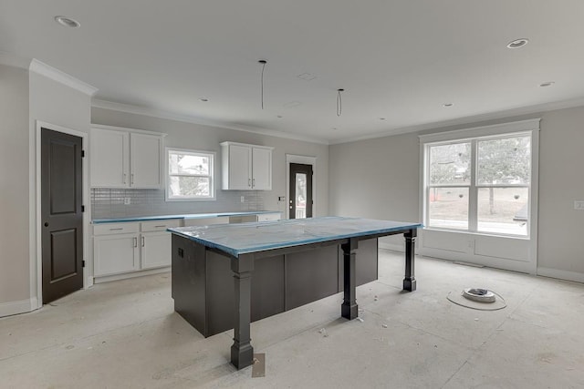 kitchen featuring a center island, white cabinets, and a kitchen bar