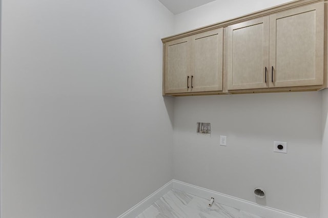 clothes washing area with cabinets, electric dryer hookup, and washer hookup