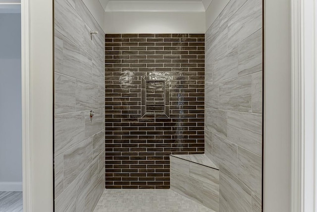 bathroom with a tile shower