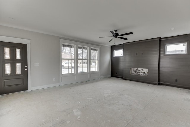 entrance foyer with ceiling fan and a healthy amount of sunlight