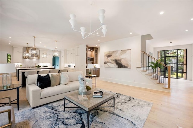 3292 Lenox Pl NE, Atlanta, GA 30324 - living area with a chandelier, stairs, light wood-type flooring, and recessed lighting
