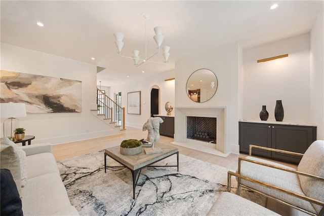 3292 Lenox Pl NE, Atlanta, GA 30324 - living area featuring stairs, arched walkways, recessed lighting, a chandelier, and light wood-type flooring