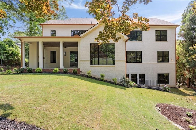 3292 Lenox Pl NE, Atlanta, GA 30324 - view of front of house featuring a front yard, brick siding, and a ceiling fan