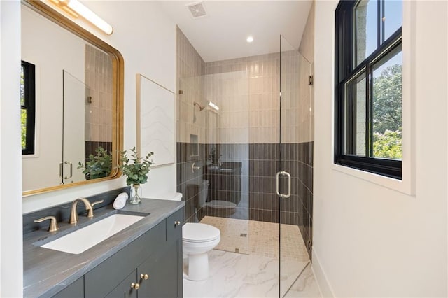 3292 Lenox Pl NE, Atlanta, GA 30324 - bathroom featuring vanity, a shower stall, marble finish flooring, and recessed lighting