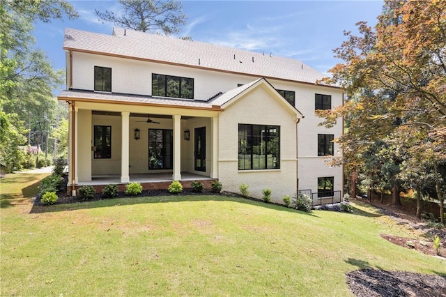 3292 Lenox Pl NE, Atlanta, GA 30324 - back of house with ceiling fan, a lawn, and brick siding
